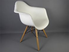 Four White Plastic Tulip Chairs