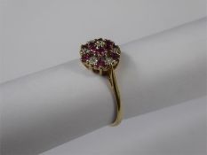 A 9ct Yellow Gold Ruby and Diamond Cluster Ring