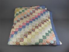 A Hand-Stitched Cotton Patchwork Quilt