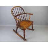 An Antique Oak Child's Windsor Rocking Chair