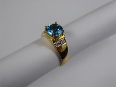 A 9ct Yellow Gold and Blue Topaz Ring