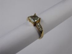 A 9ct Yellow Gold Aquamarine and Diamond Ring