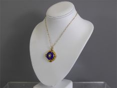 An Antique 14/15ct Yellow Gold and Blue Enamel Pendant