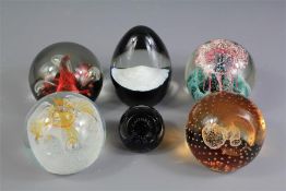 A Collection of Six Caithness Glass Paperweights.