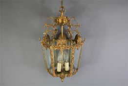 A Contemporary Brass and Glass Finish Hall Light