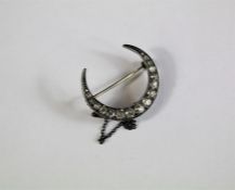 An Antique Yellow Gold and Silver Old Cut Diamond Crescent Brooch.