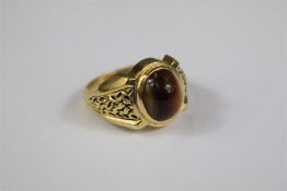 A Gentleman's Yellow-Metal Tiger's Eye Ring