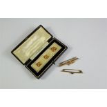 A Pair of 9ct Yellow Gold Dress Studs and Two Brooches.