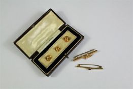 A Pair of 9ct Yellow Gold Dress Studs and Two Brooches.