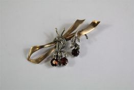 A 9ct Yellow Gold Garnet and Diamond Brooch