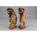 A Pair of Foster's Pottery Sea-horse Vases.