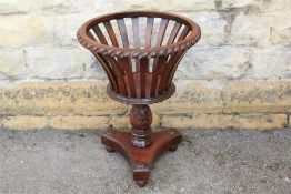 An Edwardian Mahogany Plant Stand.