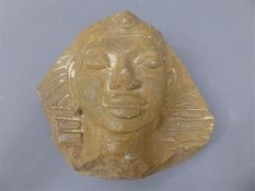 An Egyptian Rough-Hewn Red Stone Carving