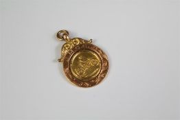 A 9ct Yellow and Rose Gold Motorcycling Medallion.