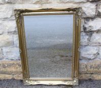 A Gilt Framed Bevelled Mirror.