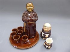 A Ceramic Decanter and Tots