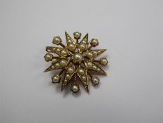A 9ct Yellow Gold Edwardian Seed Pearl Radiating Star Brooch