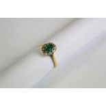 A Ladies 18ct Yellow Gold Diamond and Emerald Ring