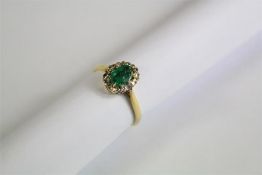 A Ladies 18ct Yellow Gold Diamond and Emerald Ring