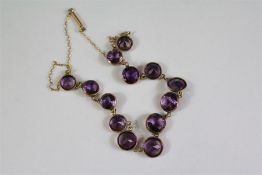 An Antique 9ct Rose Gold and Graduated Amethyst Necklace.