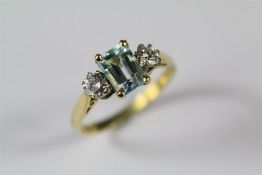 A Ladies 18ct Yellow Gold Diamond and Aquamarine Ring.