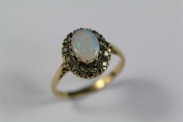 A 9ct Yellow Gold Diamond and Opal Ring
