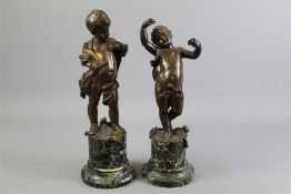 A Pair of Bronze Figural Putti