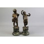 A Pair of Bronze Figural Putti