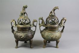 A Pair of Antique Chinese Bronze Censers and Covers