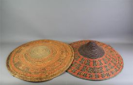 A Pair of Woven Wide Brimmed South East Asian Straw Hats.