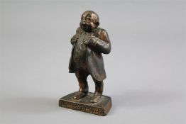 A Bronze Caricature Figurine of a Jewish Businessman