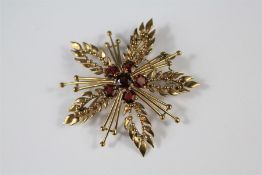 A 9ct Yellow Gold and Garnet Brooch