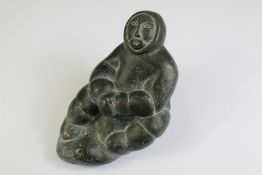 A Carved Eskimo Stone Sculpture of a Hunter.