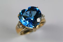 A 9ct Yellow Gold Diamond and Topaz Ring