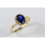 A 14ct Yellow Gold Sapphire and White Stone Ring