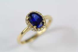 A 14ct Yellow Gold Sapphire and White Stone Ring