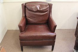 A Dark Brown Faux Leather Wing-Back Chair