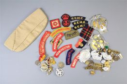 A Collection of British Army Shoulder Titles and Cap Badges