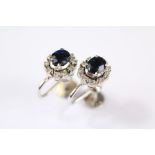 A Pair of White Gold Sapphire and Diamond Earrings