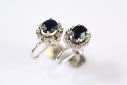 A Pair of White Gold Sapphire and Diamond Earrings