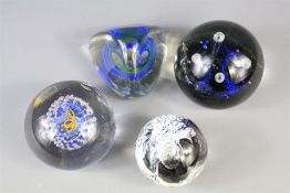 Four Glass Paperweights