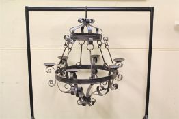 A Large Wrought Iron Candle Chandelier