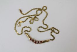 A 9ct Yellow Gold and Ruby Pendant Necklace