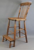 An Antique Oak Bar Chair
