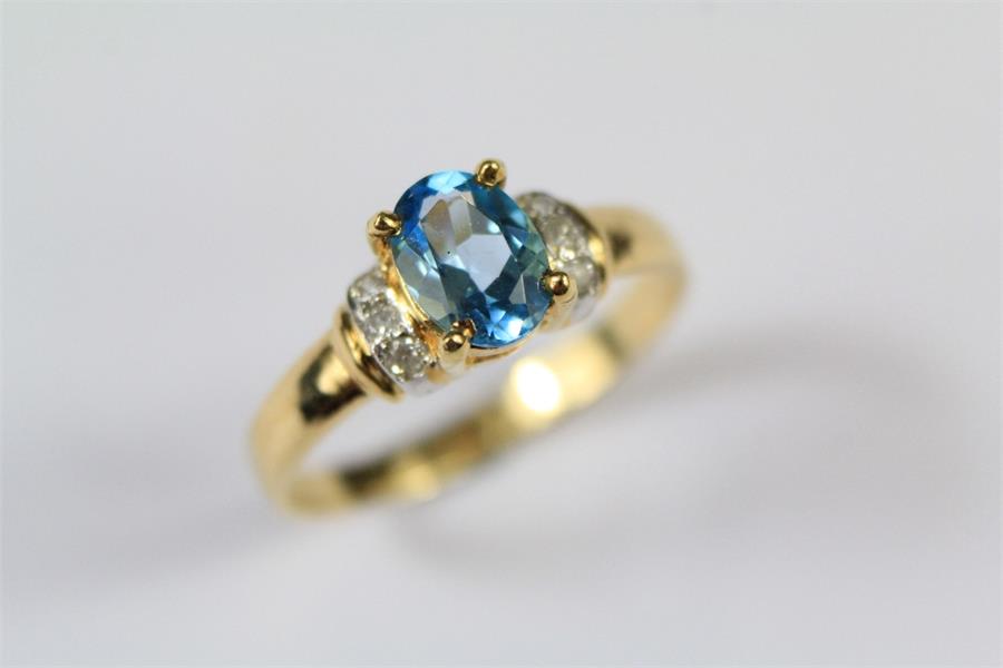 An 18ct Yellow Gold Blue Topaz and Diamond Ring