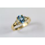An 18ct Yellow Gold Blue Topaz and Diamond Ring