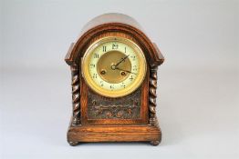 An Edwardian Oak Mantel Clock