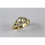 An 18ct Yellow Gold Pearl and Diamond Ring