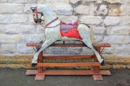 A Vintage Hand-Carved Wooden Rocking Horse