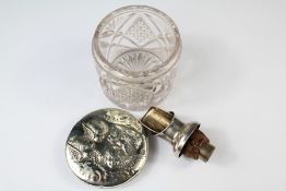 A Silver Topped Cut-Glass Cotton Jar. The lid depicting winged putti, Birmingham hallmark, mm BPDC